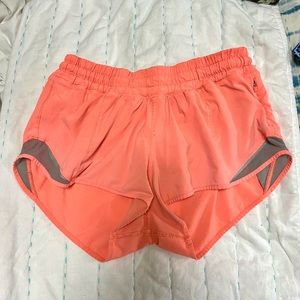 Def worn lululemon bright orange shorts